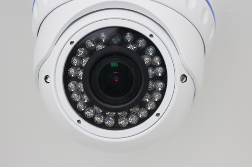 Close up of a ceiling mounted spherical security camera