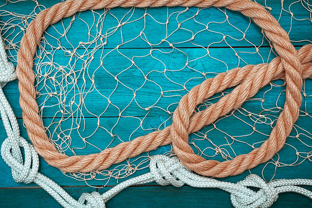 istock Marine Network and rope on white old boards 531707680