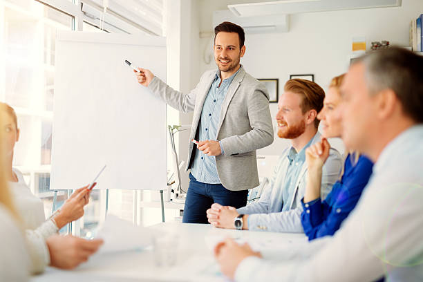 Presentation and training in business office Lecture and  training  in business office for white collar colleagues flipchart stock pictures, royalty-free photos & images