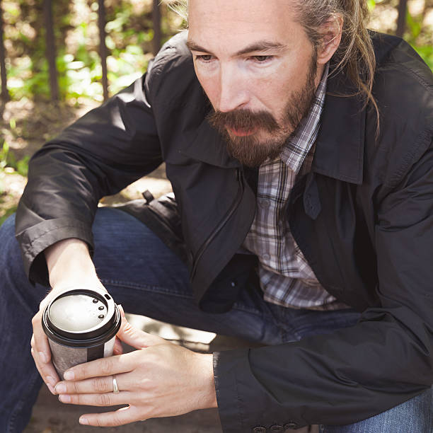 istock Bearded man with coffee in paper cup, outdoor 531708192