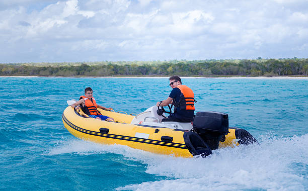 istock father and son on an inflatable boat 531708829