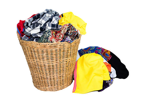istock Colorful clothes in basket isolated on white 531710848