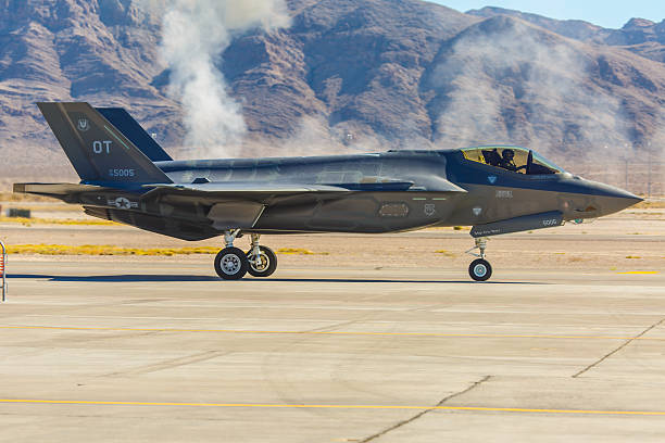 F-35 fighter taxis on the runway at Nellis AFB Las Vegas, USA- November 8, 2014: F-35 fighter taxis on the runway during Aviation Nation at Nellis AFB on November 8,2014 in Las Vegas,NV. F-35 is the world's most advanced multi-role fighter.  supersonic airplane editorial airplane air vehicle stock pictures, royalty-free photos & images