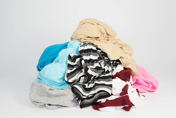 istock pile of clothes on white background 531711036