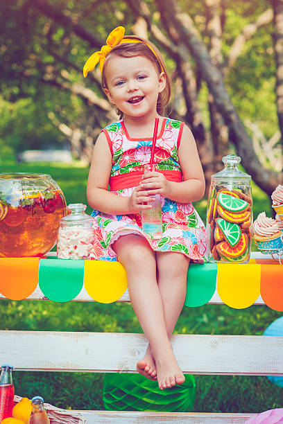 istock Child behind lemonade stand 531711412
