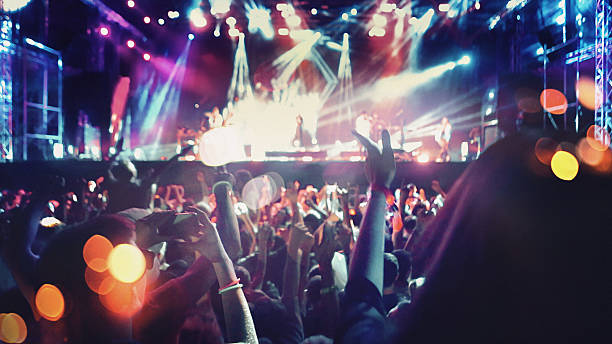 istock People at concert party. 531711528