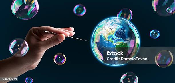 Explosion Bubble Earth With Needle Planet At Risk Stock Photo - Download Image Now