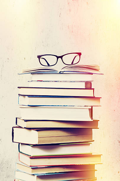 istock books and eyeglasses 531712476