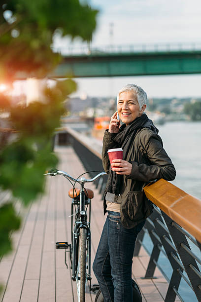 istock Mature Woman Talking On The Phone And Drinking Coffee. 531712648