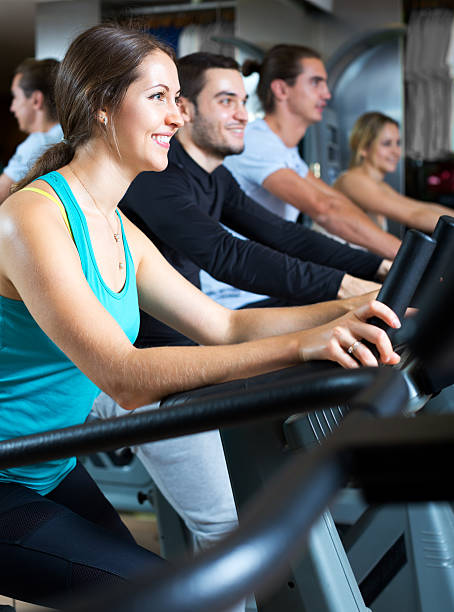 istock Active adults riding stationary bicycles 531712722