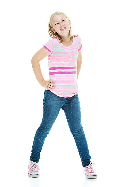 istock Smiling little girl standing & looking at camera 531713099