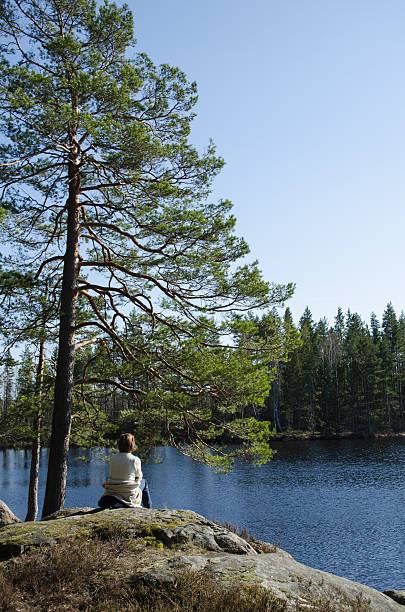 istock Woman resting by lake side 531714537