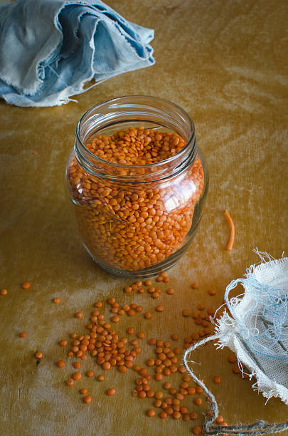 istock Orange lentils in a jar of glass 531714662