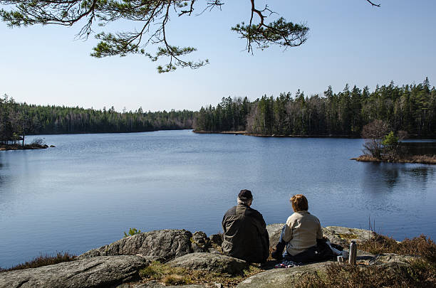 Senior couple resting at lake side