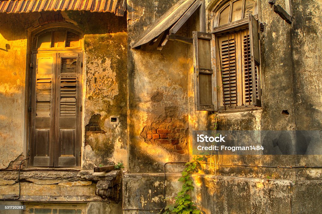 Urban decay Urban decay photo of an abandoned house with the doors and windows shuttered up. 2015 Stock Photo