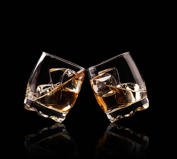 istock Glasses of whiskey on black background 531721641