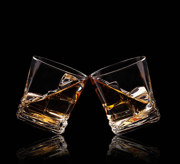 istock Glasses of whiskey on black background 531721655
