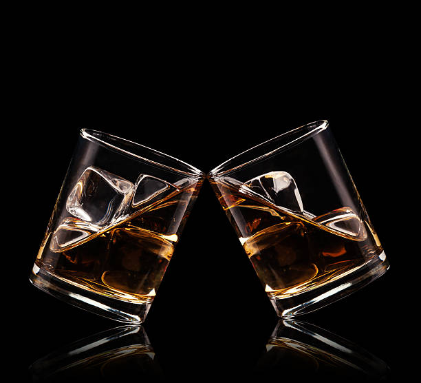 istock Glasses of whiskey on black background 531721659