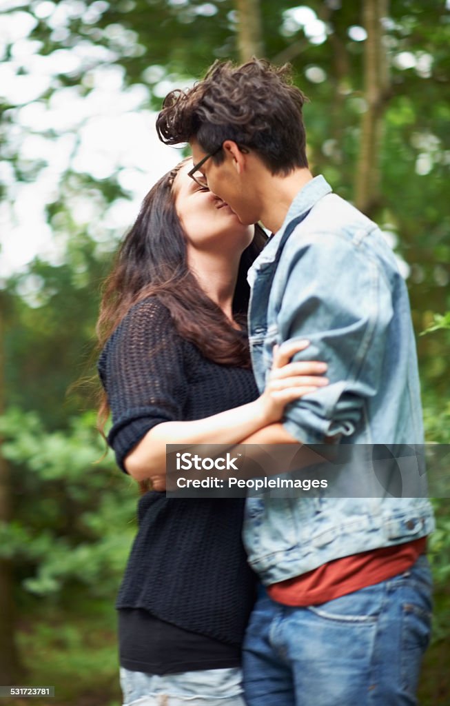 Young love Cute young couple standing outside and kissinghttp://195.154.178.81/DATA/shoots/ic_781479.jpg Kissing Stock Photo