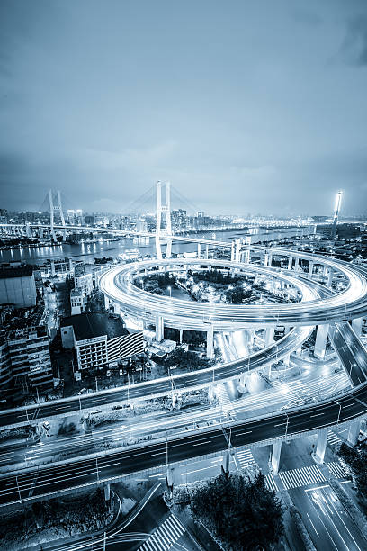 istock shanghai elevated road junction and interchange overpass at night 531725779