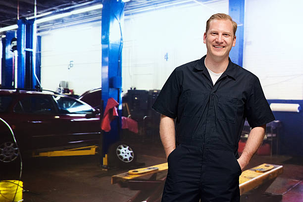 istock Smiling mechanic in auto repair shop 531727085