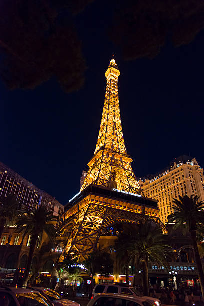 Las Vegas, Nevada, USA - June 7, 2014: Night time street view of the Las Vegas Strip in Nevada with car traffic and people strolling around. Showing predominantely Paris hotel and casino.