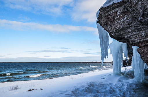 Icy limestone cliffs at the coast of the swedish island Oland in the Baltic sea.