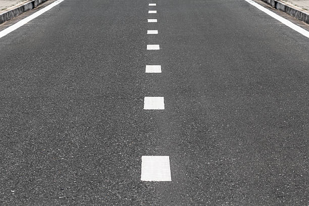 istock Dividing line on surface street. 531727885