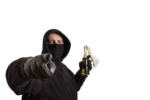 istock Black Block fellow with Molotov Cocktail 531733623