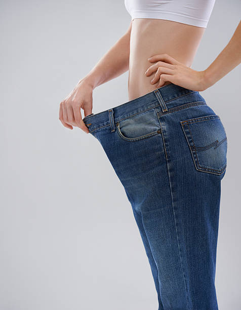 You can achieve this too Cropped shot of a woman showing off her weightloss with a large pair of trousershttp://195.154.178.81/DATA/shoots/ic_784502.jpg too thin stock pictures, royalty-free photos & images