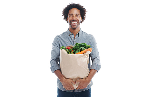 A handsome young black man holding grocerieshttp://195.154.178.81/DATA/shoots/ic_783849.jpg