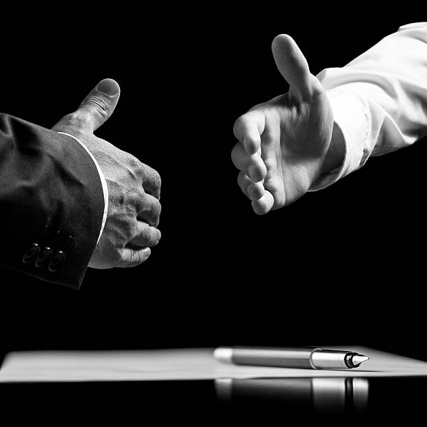 istock Businessmen about to shake hands over a signed contract 531736339