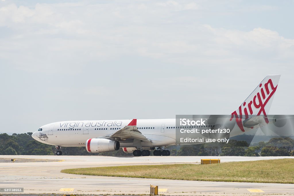 Virgin Australia passenger aircraft Melbourne, Australia - December 14, 2014: Virgin Australia passenger aircraft at Tullermarine Airport, Melbourne Australia readying for departure 2015 Stock Photo