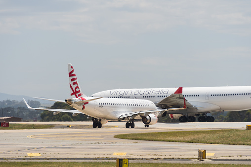 Melbourne, Australia - December 14, 2014: Virgin Australia passenger aircraft at Tullermarine Airport, Melbourne Australia readying for departure
