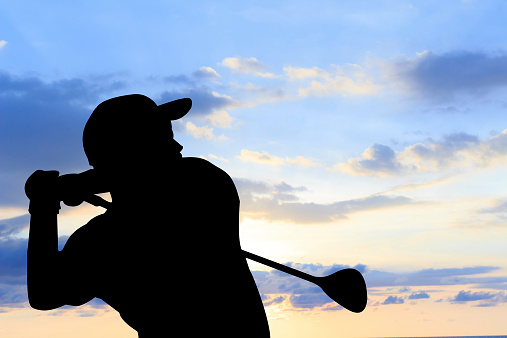 Hole-in-one celebration for a professional golfer. He's celebrating at sunset.