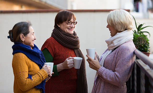 istock Senior women drinking tea at balcony 531753429