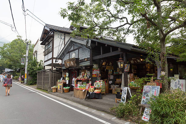 Yufu, Japan - September 2, 2014 : People walk past the Yufuin Shopping Street in Oita Prefecture, Japan. Yufuin is a popular hot spring resort in Japan. The shopping street is full of souvenir shops, cafes and boutiques. 