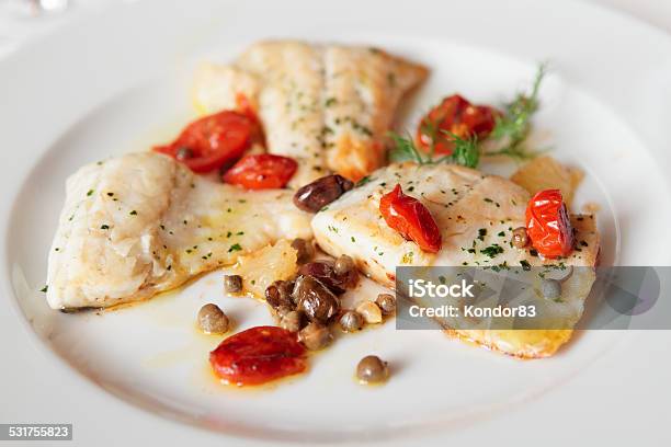Fried Fish Fillet With Capers And Tomatoes Stock Photo - Download Image Now - Caper, Sea Bass, Tomato