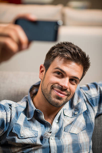 istock Young man taking selfie with phone 531755891