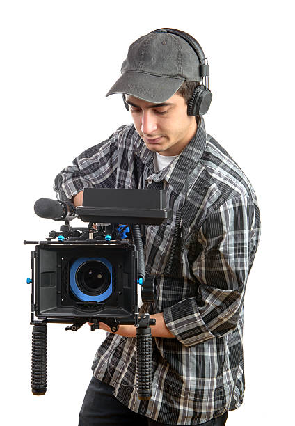 young cameraman con película de cámara - videographer video camera operator filming fotografías e imágenes de stock