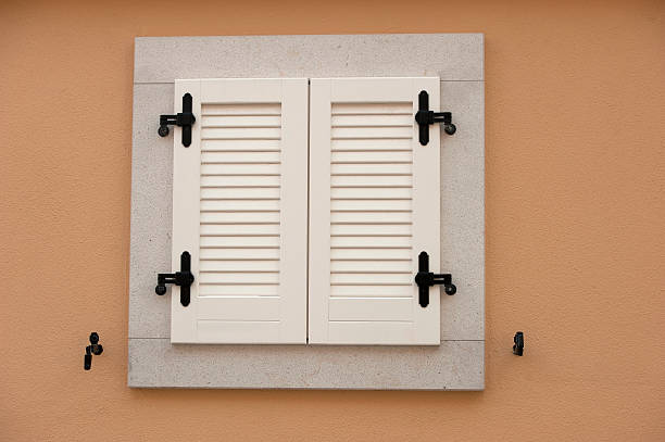 istock Window with Shutter on brown Waal of a new House 531756739