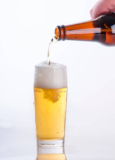 istock Beer pouring from a bottle into a glass 531758335