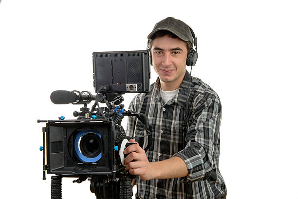 istock young cameraman with movie camera 531760037