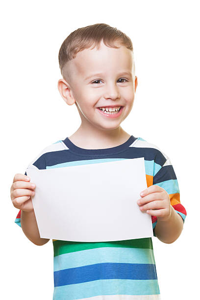 istock Smiling boy with piece of paper 531760049