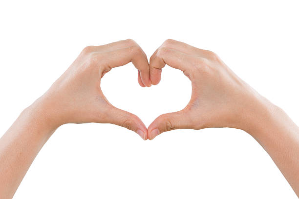 istock Female hands making a heart shape isolated on white background 531771249