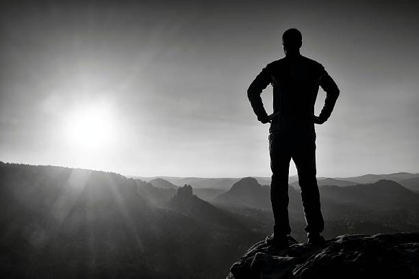 istock Silhouette of Young Confident and Powerful Man stand 531772078