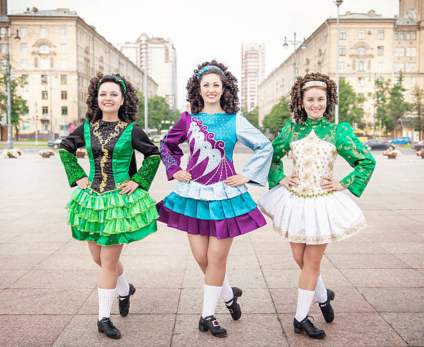 istock Three women in irish dance dresses posing outdoor 531772501