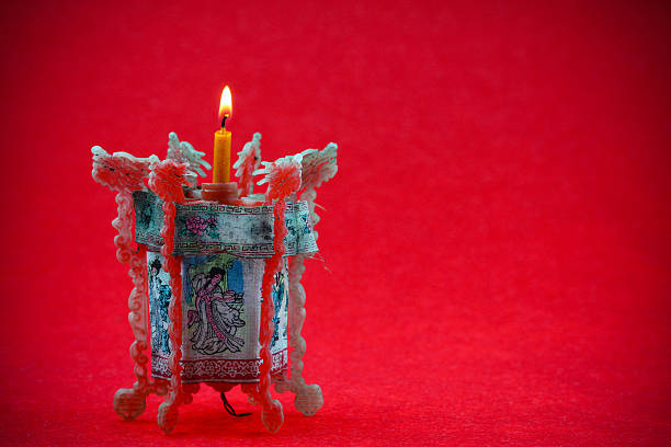 istock Old lamp in china style with candle on red background 531772701