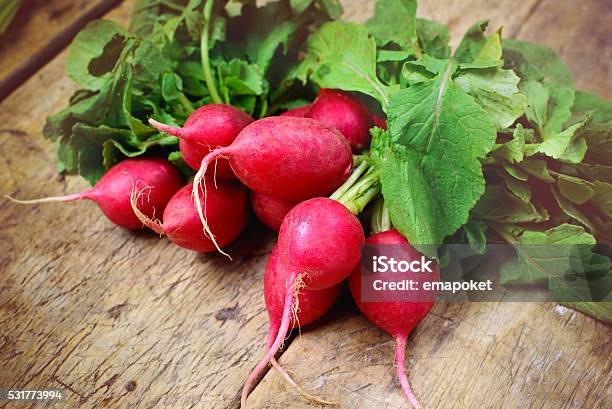 Fresh Radishes On Old Wooden Table Stock Photo - Download Image Now - Radish, Bunch, Bundle