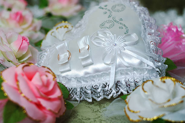 istock pillow as heart with wedding rings 531774004